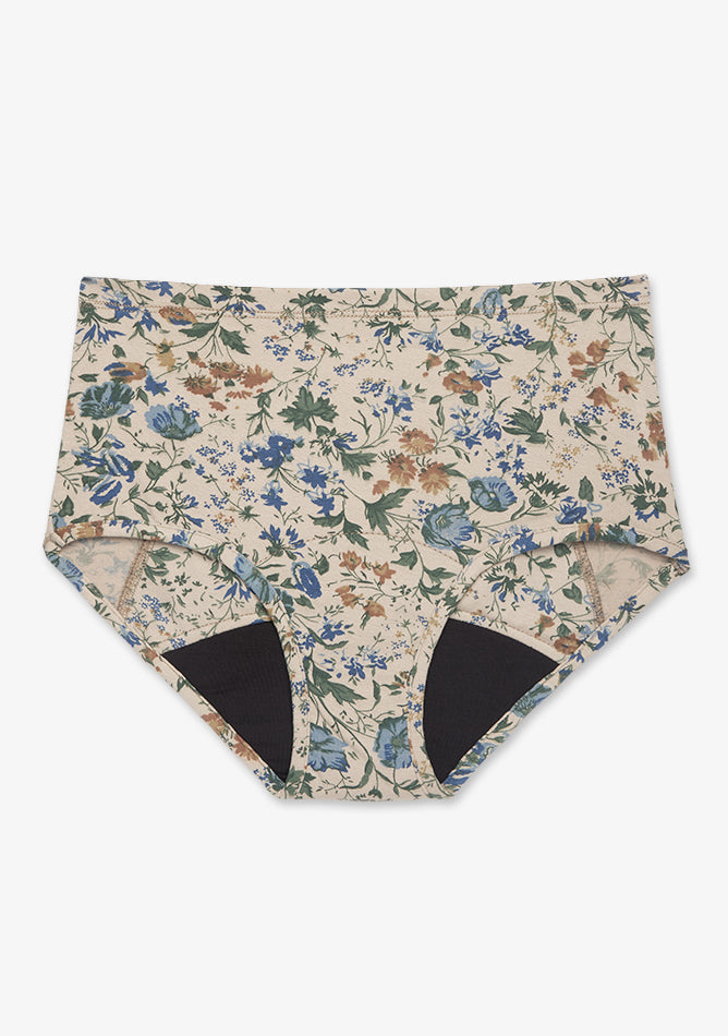 High-waisted cream floral period underwear designed for overnight or heavy flow. It features a wide black absorbent gusset for full leak protection and offers a soft, breathable, and comfortable fit with a vintage-inspired floral print.