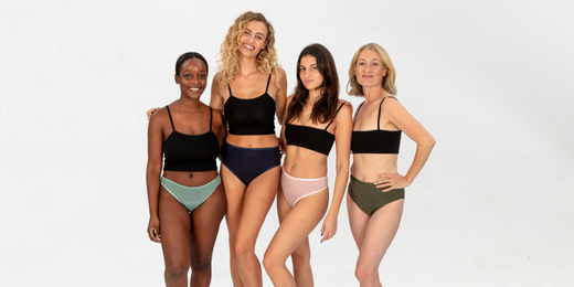 Group image of four women wearing Ugly Pants Period Pants in sage, navy, blush and olive, all paired with black tops.