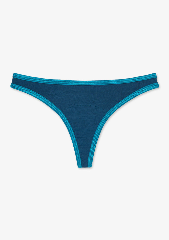Image shows a teal-colored thong with contrasting turquoise stitching and waistband edges. The thong has a minimal, sleek design typically used for discreet wear under clothing. It features a low-rise cut and a narrow front panel that tapers into a thin strip at the back. The fabric appears to be soft and stretchy, likely a blend suitable for everyday or specialty use such as period underwear or moisture-wicking wear. 